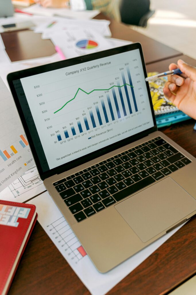 pexels-photo-5466250-5466250 A close-up view of a laptop displaying business analytics and revenue charts.